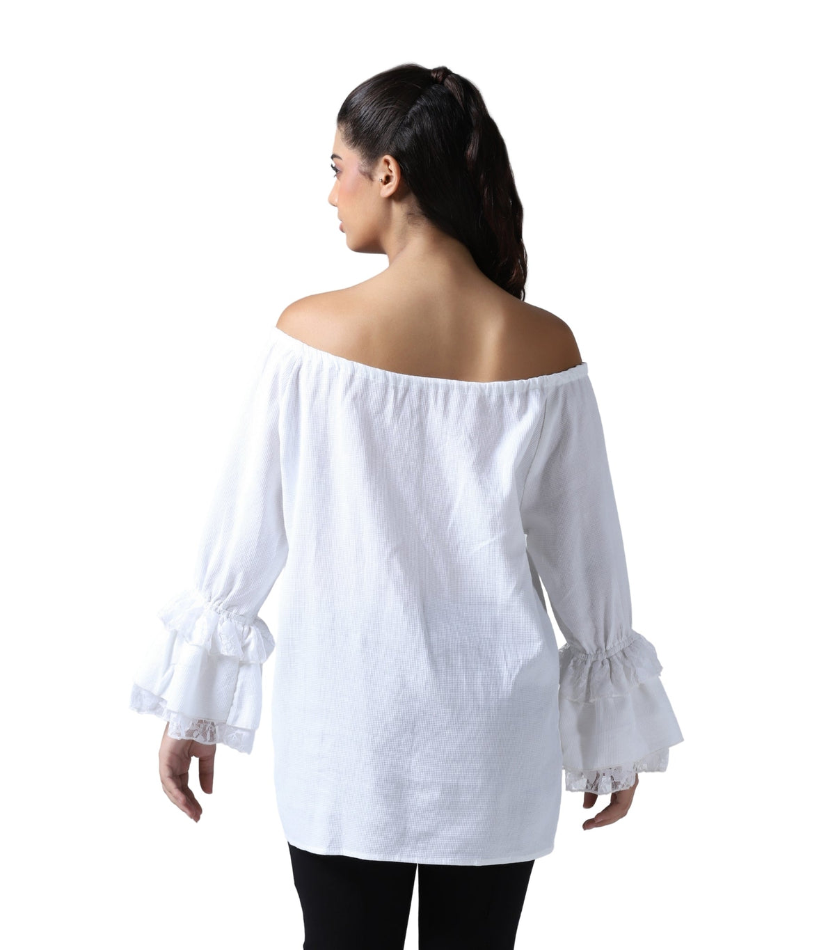 A woman shown from the back wearing a white off-the-shoulder blouse with long ruffled bell sleeves and black pants, against a plain white background.