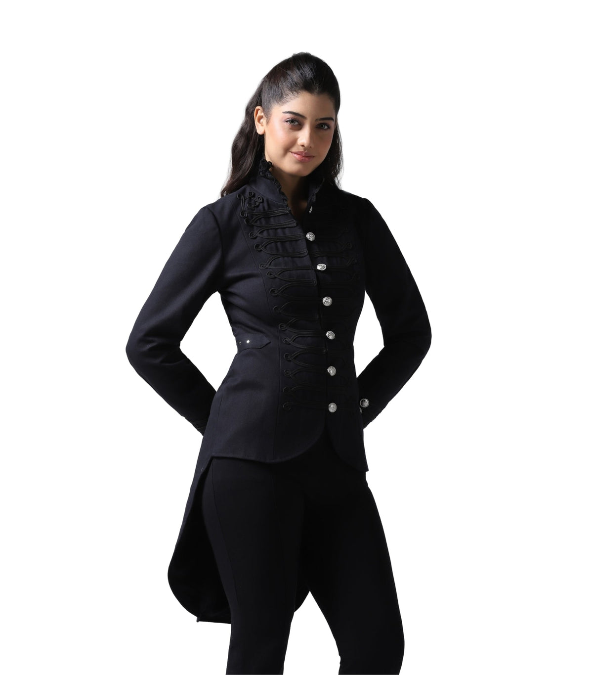 A woman modeling a black long-sleeve high-collar jacket with decorative ruffles and silver buttons, paired with black trousers, against a plain white background.