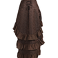 Back view of a model wearing a coffee-brown brocade skirt with a flowing floor-length ruffled hem.