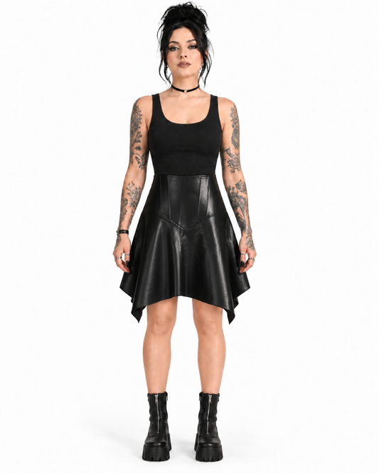 Front view of a model wearing a black PU asymmetrical skirt with a sculpted V-panel waist and pointed handkerchief hem.
