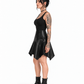 Side view of a model wearing a black PU handkerchief-hem skirt with a high panelled waist and uneven pointed drape.