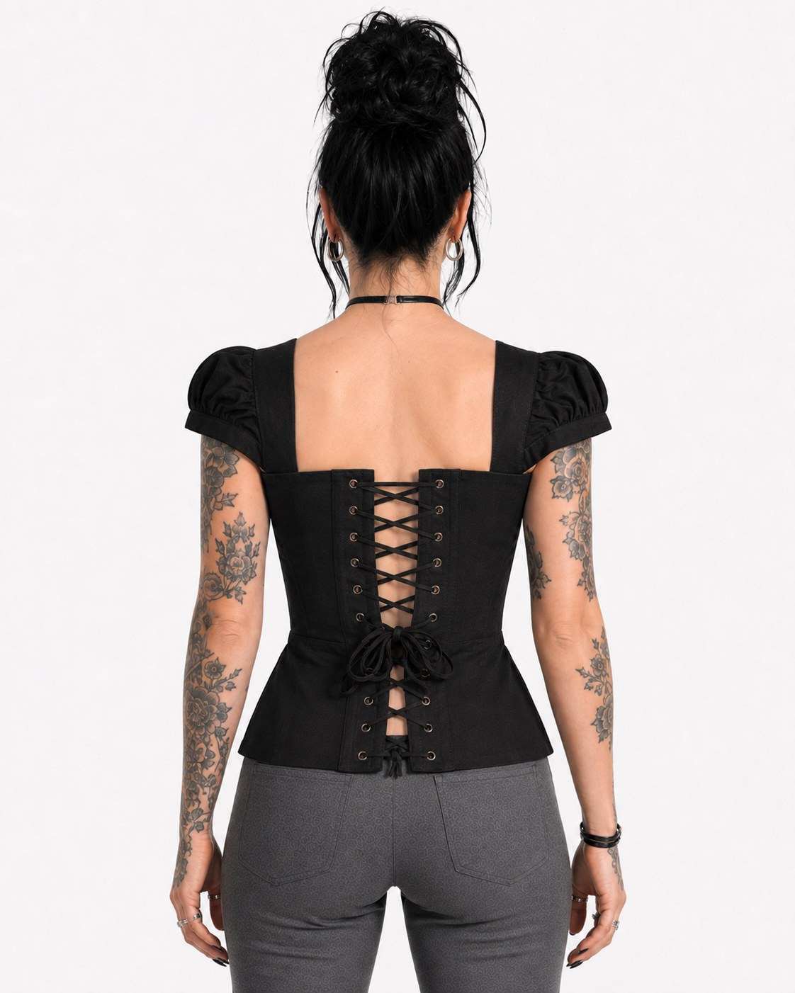 Back view of a black Gothic puff-sleeve corset top featuring metal eyelets and an adjustable lace-up closure.
