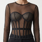close up view of model wearing Black polka dot mesh corset 