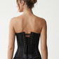 back view of model wearing Black strapless floral lace overbust corset with satin panel detailing,scalloped eyelash-lace hem.


