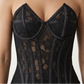 close view of black floral mesh over bust steel boned corset